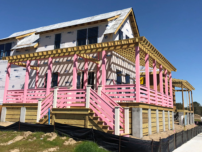 Residential deck with seating area and railing