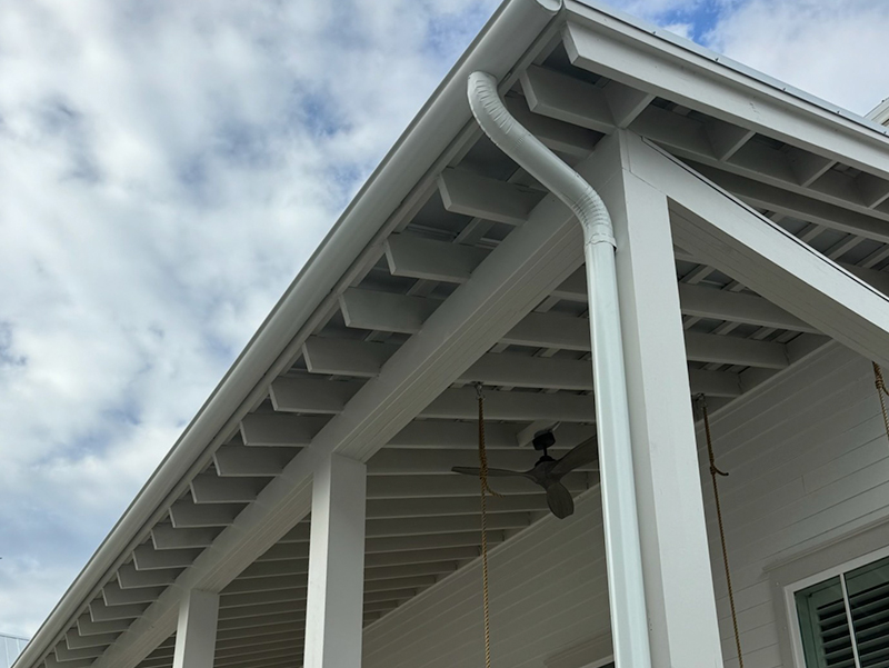 Roof gutter system installed along residential roofline