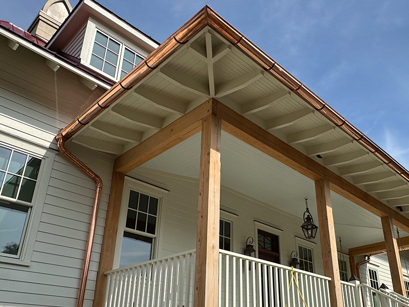 Residential home gutter system protecting roof edges
