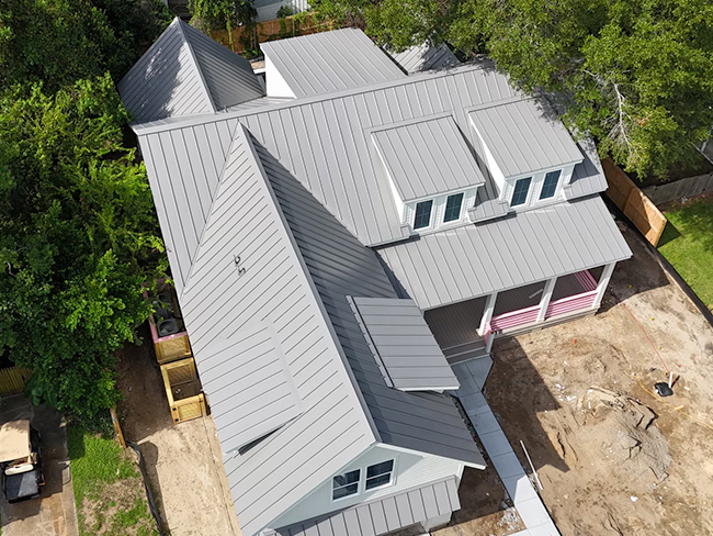 Residential property showcasing roofing and exterior construction materials